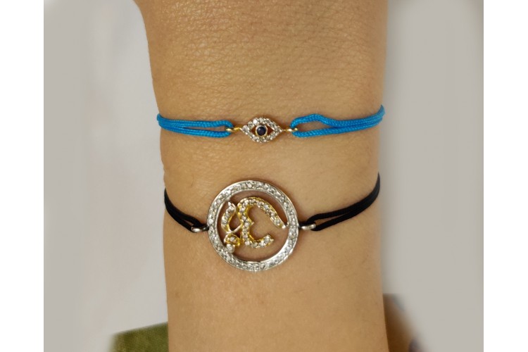 Evil Eye charm bracelet with Diamonds & Sapphire in Gold